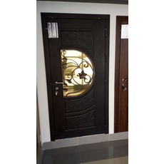 Двері металеві вулічні з декоративного кування и склом, накл